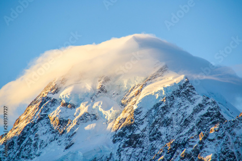 View of the highest mountain of New Zealand Aoraki/Mount Cook. Located in Aoraki/Mount Cook National Park, South Island. Sunset over the snow covered mounatin. Tourist popular attraction/destination.