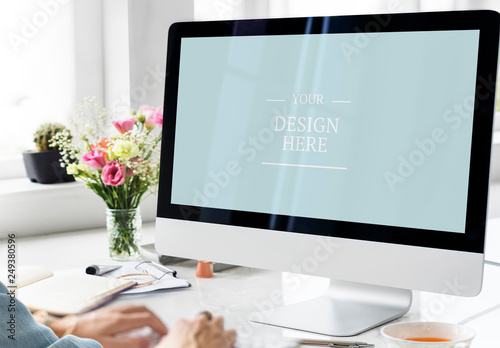 User at Desktop Computer with Flowers and Coffee Mockup