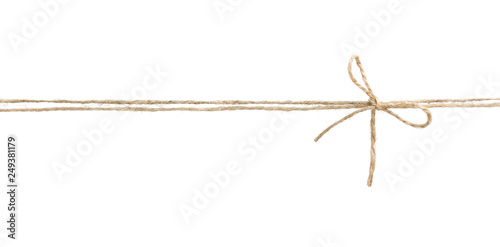 Twine rope with bow isolated. photo