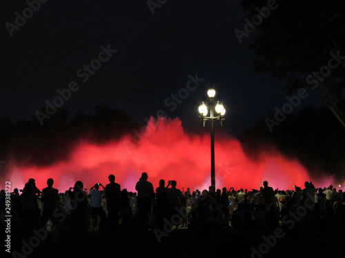 Many people enjoy the show of singing fountains,  Barcelona, Catalonia, Spain.