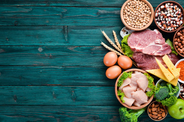 Balanced diet food background. Protein foods On a blue wooden background. Free space for your text.