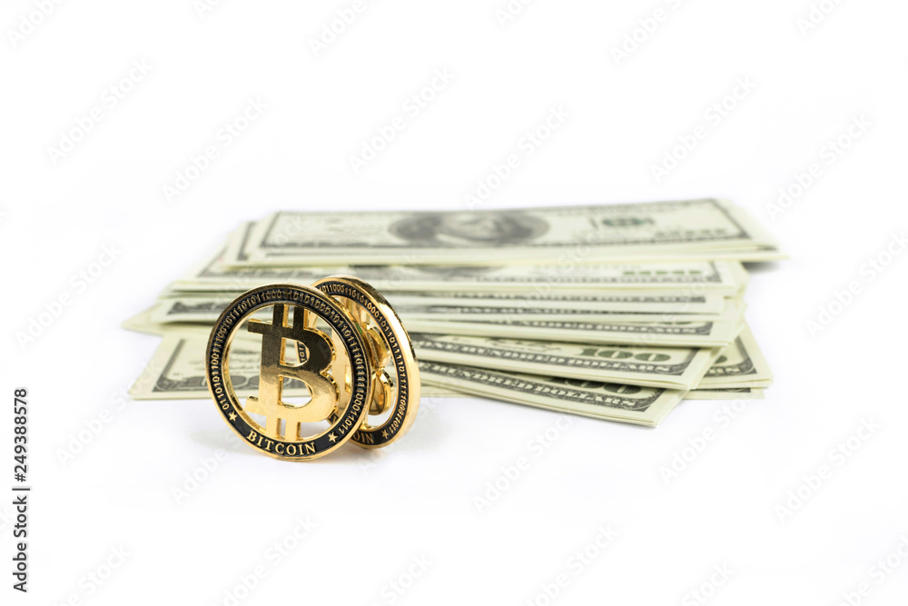 Dollars paper and coins bitcoins are located on a white background
