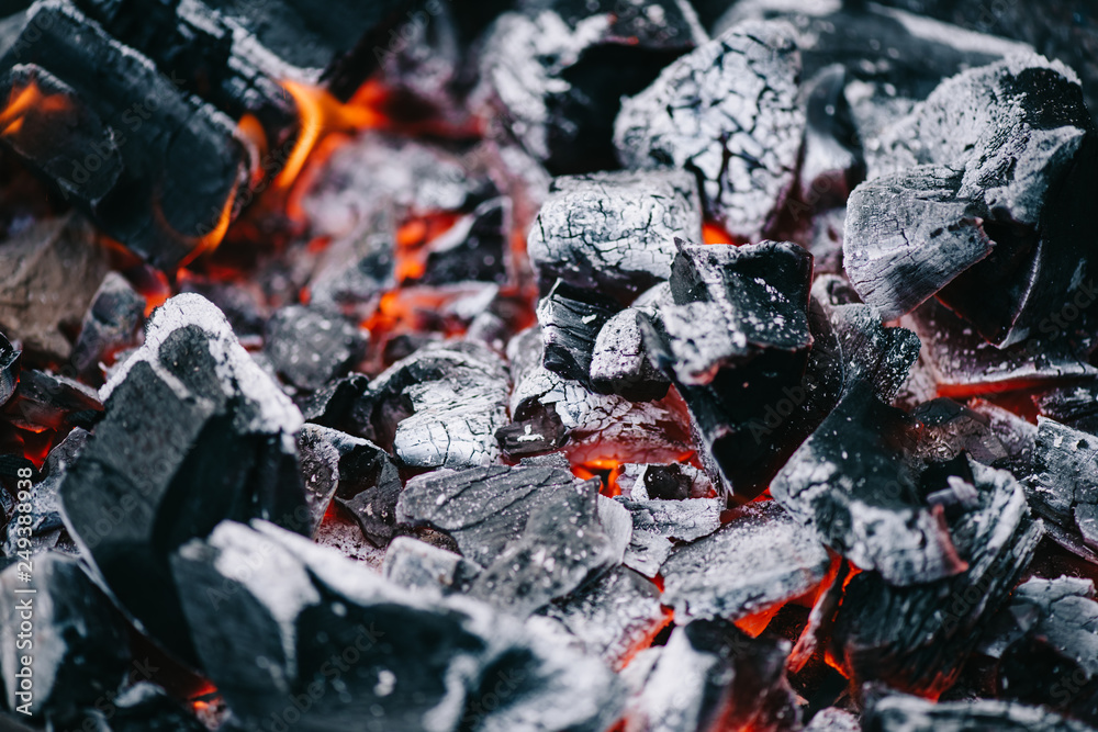 selective focus of hot burning coals in white ash selective focus of hot burning coals in white ash