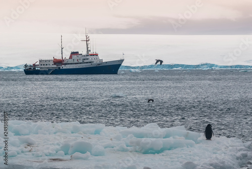 Expedition ship, cruise in Antarctic landscape, Paulet island, near the Antarctic Peninsula photo