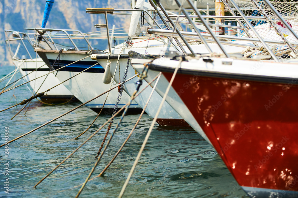 Sailboat harbor, Close up of many beautiful moored sail yachts and boats in the sea port, modern water transport, summertime vacation