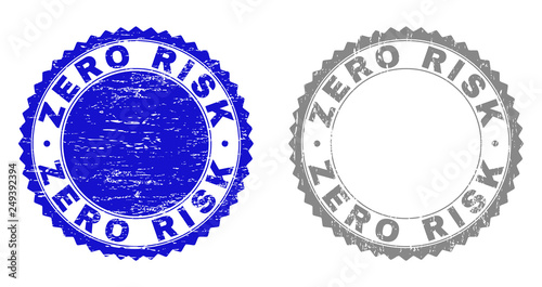 Grunge ZERO RISK stamp seals isolated on a white background. Rosette seals with distress texture in blue and gray colors. Vector rubber stamp imitation of ZERO RISK caption inside round rosette.