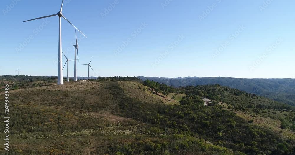 Aerial video of wind mills on hills, electric power production by means of wind, clear energy, ecology Aerial video of wind mills on hills, electric power production by means of wind, clear energy, ecology