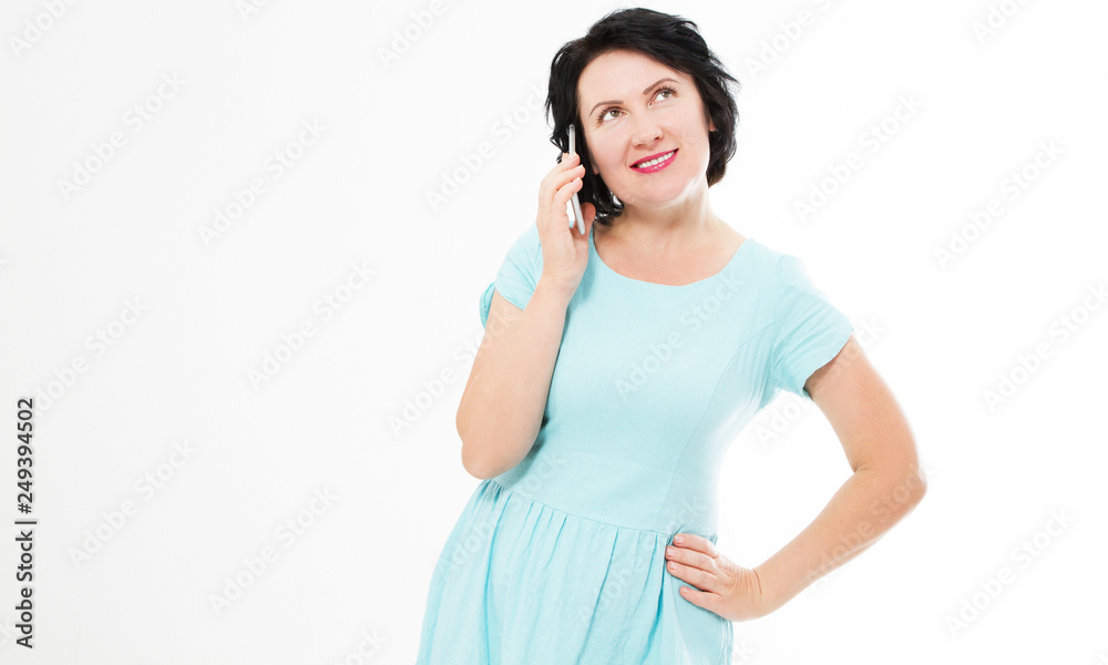 Attractive, successful and happy middle aged brunette woman in blue dress female using mobile cell phone Attractive, successful and happy middle aged brunette woman in blue dress female using mobile cell phone