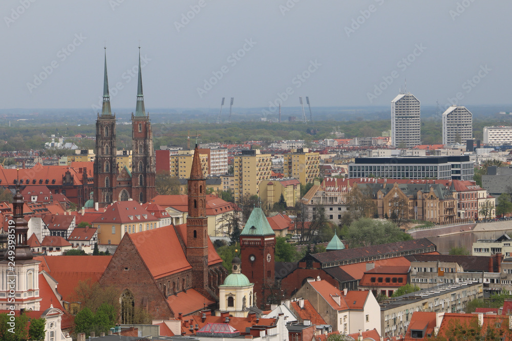 Warm, spring day in Wroclaw. View from the tower of the church of Saint Elizabeth to the Cathedral, Ostrów Tumski, churches, Odra River, blocks of flats, the Olympic Stadium, dormitories, tenements