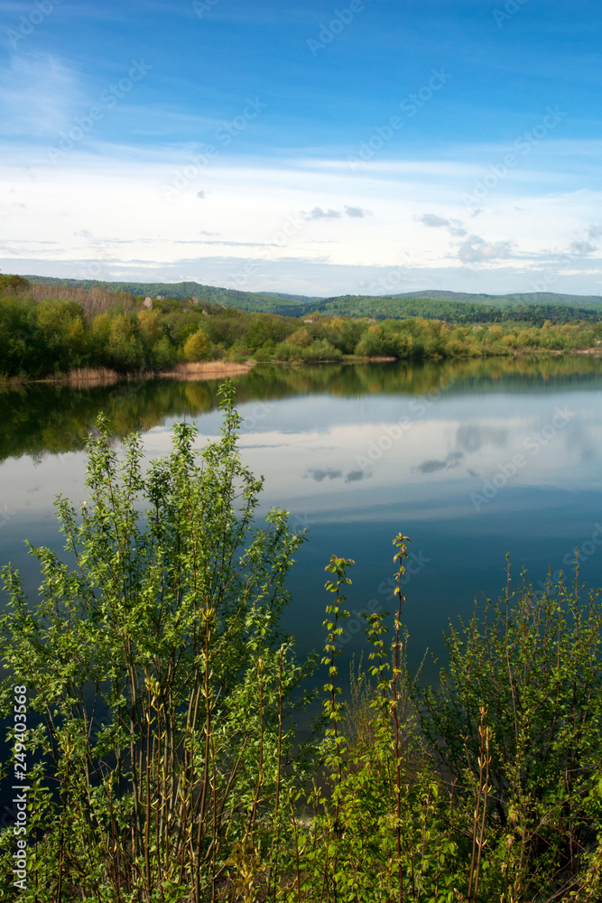 Spring panorama of a forest lake