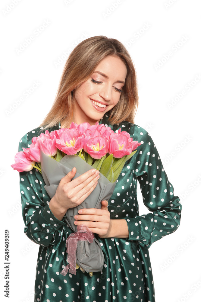 Portrait of smiling young girl with beautiful tulips on white background. International Women's Day Portrait of smiling young girl with beautiful tulips on white background. International Women's Day