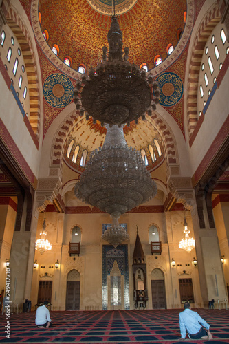 Men praying inside of mohammed al amin mosque, Beirut, Lebanon, Middle East photo