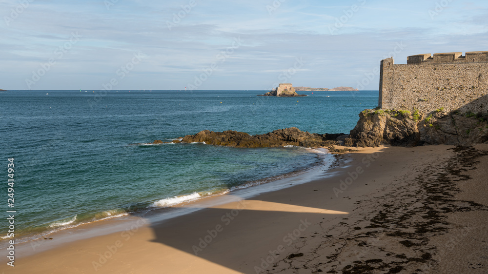 Beach, wall and fort in Saint-Malo on a sunny day in summer