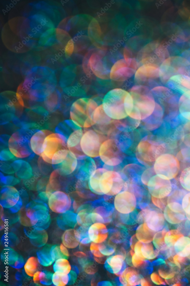 Beautiful glitter with large bokeh macro lens used on the multicolored sparkling surface Beautiful glitter with large bokeh macro lens used on the multicolored sparkling surface
