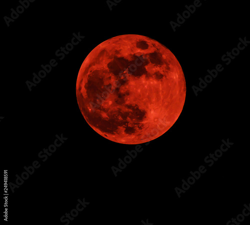 Fototapeta Naklejka Na Ścianę i Meble -  Red moon real / full blood moon on black sky dark background - selective focus
