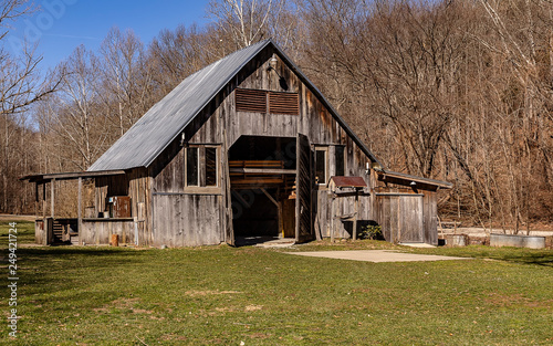 An old wooden barn on beautiful winter day. 