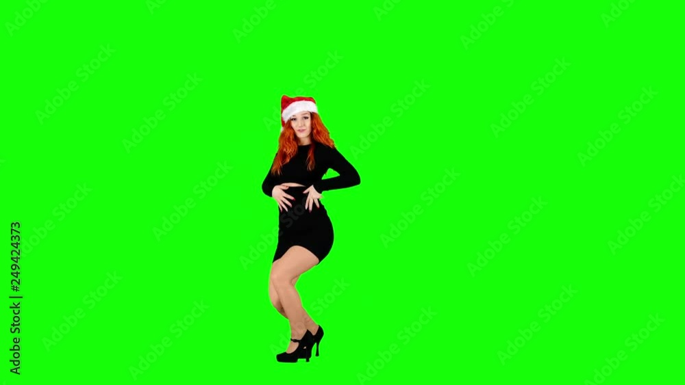 Girl in Santa Hat Dancing on Green Screen Girl in Santa Hat Dancing on Green Screen
