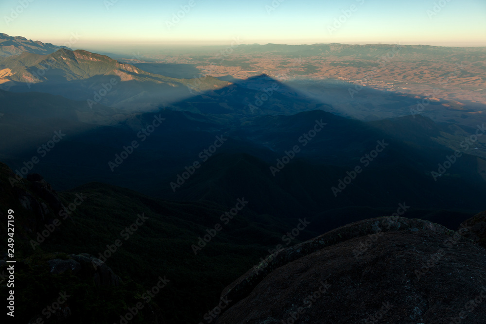 Triangular shadows of a mountain seen from the summit in mantiqueira range - Brazil Triangular shadows of a mountain seen from the summit in mantiqueira range - Brazil