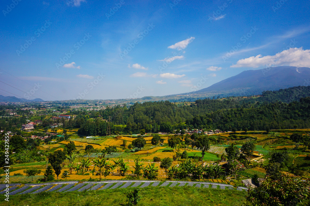 big mountain on the farming area with landscape scenery on tropical paradise country - photo indonesia