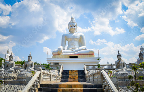 Buddha statue beautiful sitting on outdoor bright day blue sky background