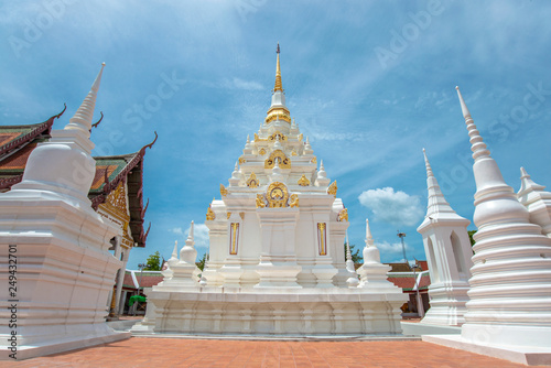 church, pagoda, the sanctuary of the temple at Wat Phra Borommathat Chaiya as background blue sky, Surat Thani, Thailand. 