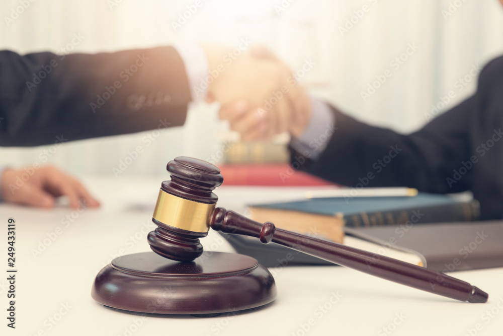 Concepts of law, Lawyer and businessman working and discussing business contract papers in office. Concepts of law, Lawyer and businessman working and discussing business contract papers in office.
