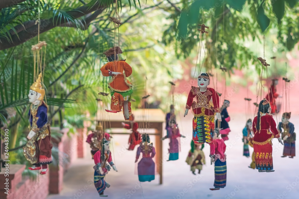 Fototapeta premium Traditional handicraft puppets for sale in the ancient pagoda in Bagan, Myanmar