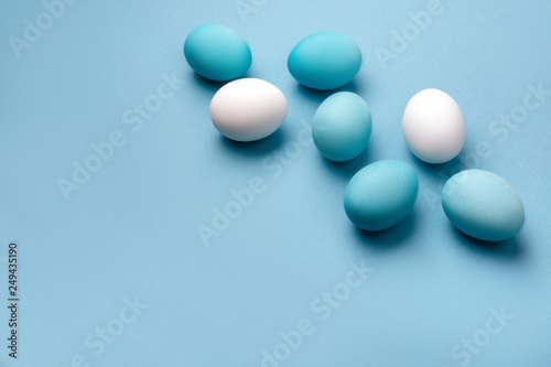 Group ombre blue Easter eggs on colorful background. close up © Margo Basarab