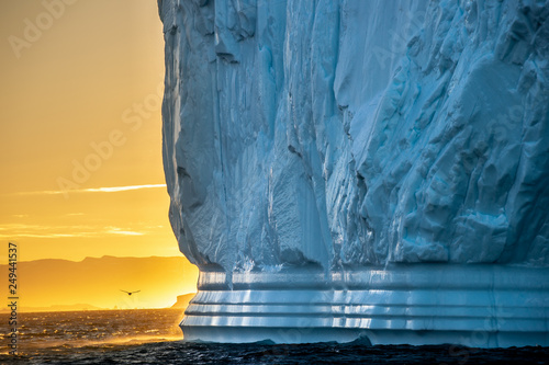 Iceberg at sunset. Nature and landscapes of Greenland. Disko bay. West Greenland. photo