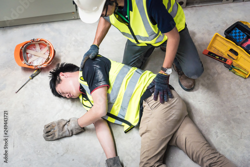 Check Response, Life-saving and rescue methods. Accident at work of electrician job or Maintenance worker in the control room of factory. photo