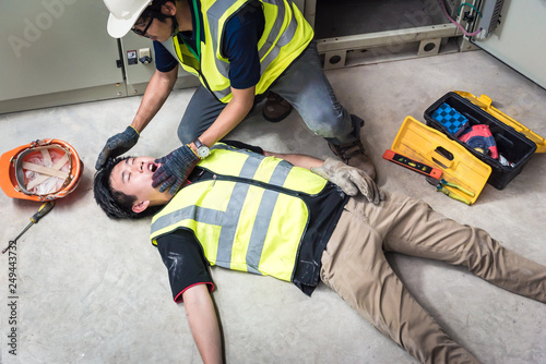 Establish an airway, Life-saving and rescue methods. Accident at work of electrician job or Maintenance worker in the control room of factory.
