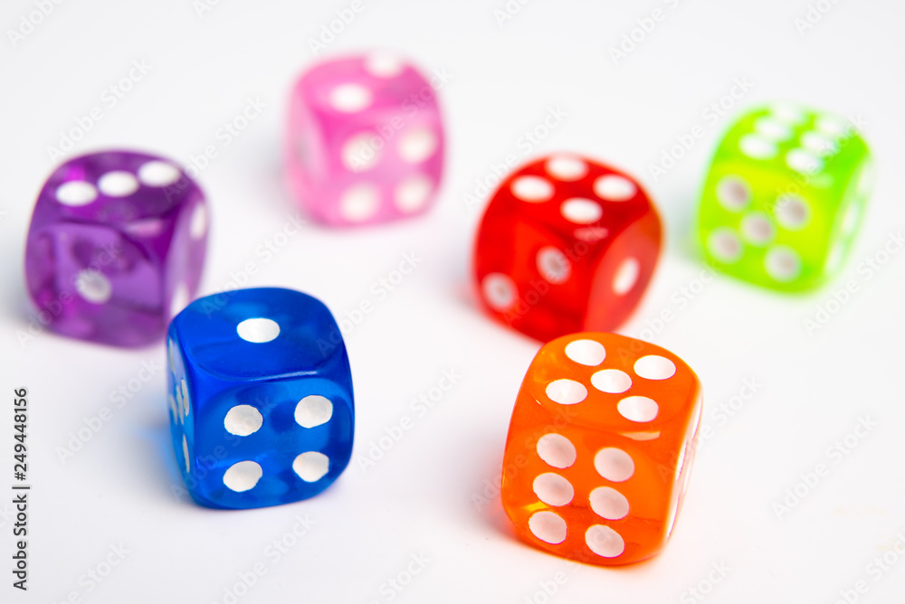 Dice of different colors isolated on a white background. Dice of different colors isolated on a white background.