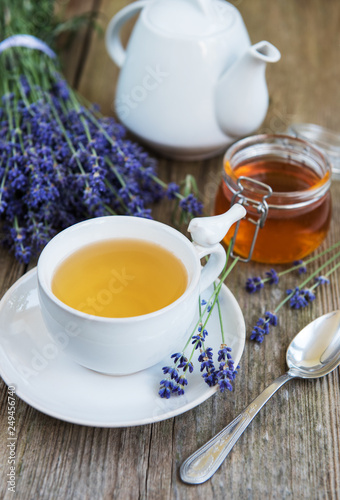 Cup of tea and honey with lavender flowers