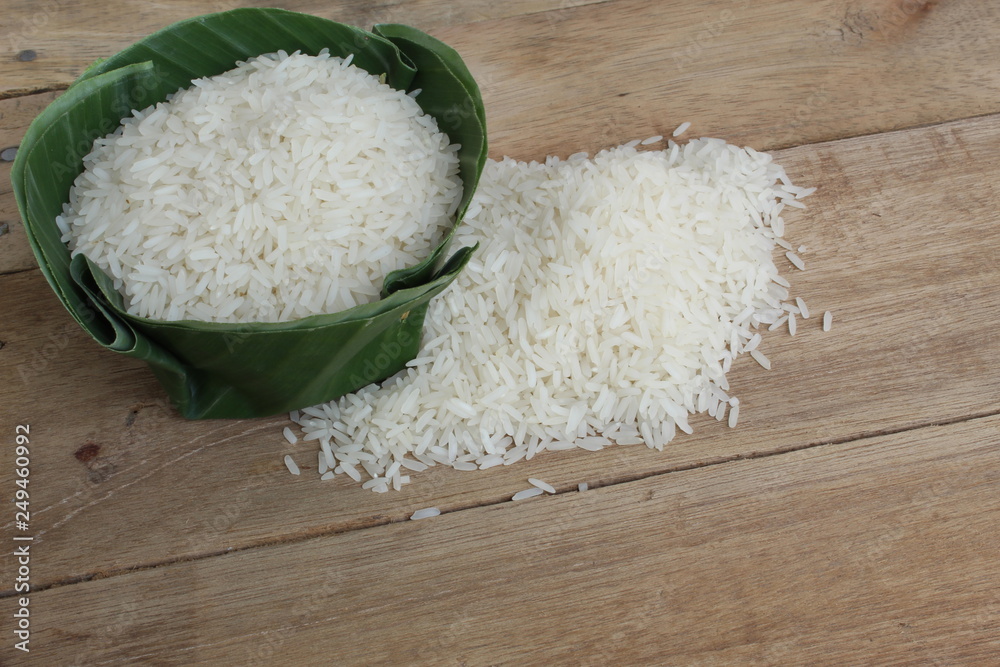 white Thai Jasmine rice in a wooden bowl white Thai Jasmine rice in a wooden bowl