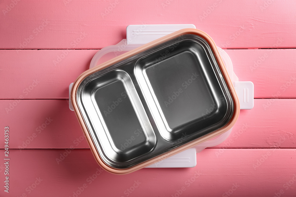 Empty school lunch box on color wooden background Empty school lunch box on color wooden background