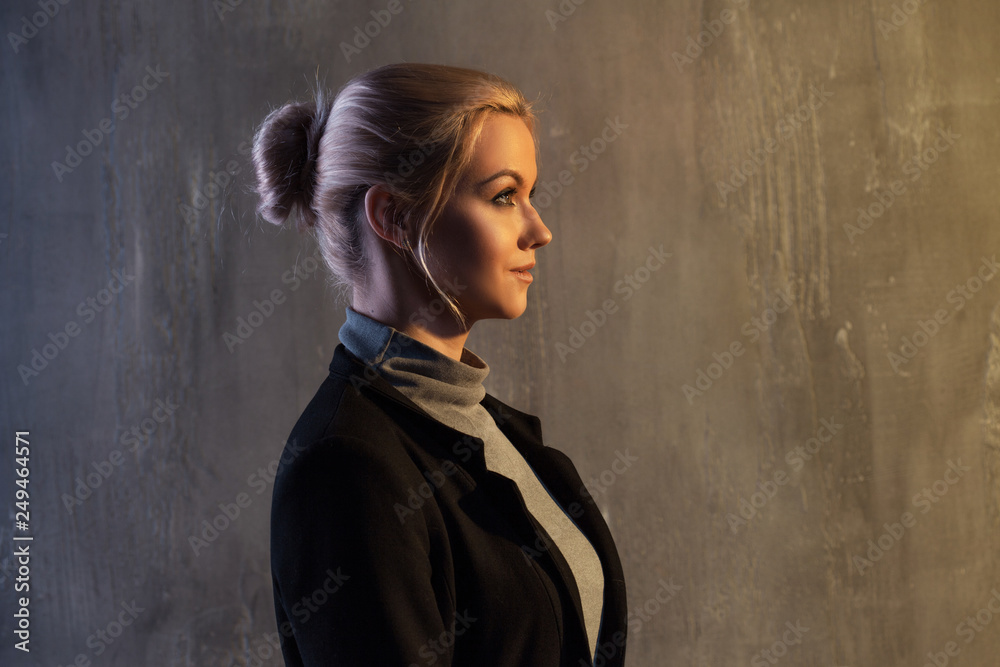 Fototapeta premium Portrait of beautiful blonde woman. Calm and self-confidence. Beautiful adult girl in black turtleneck