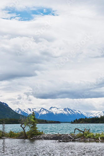 Chilko Lake with snow covered mountains photo