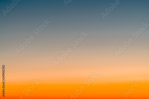 Sky gradient from blue to orange sunset фототапет