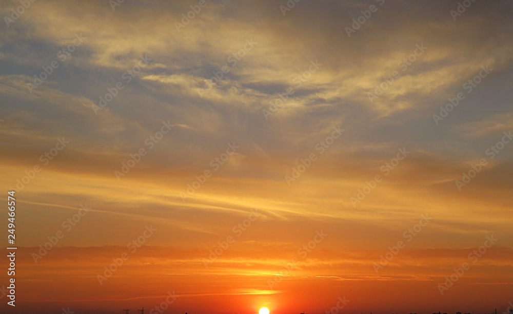 Beautiful fiery golden orange sunset, natural background 