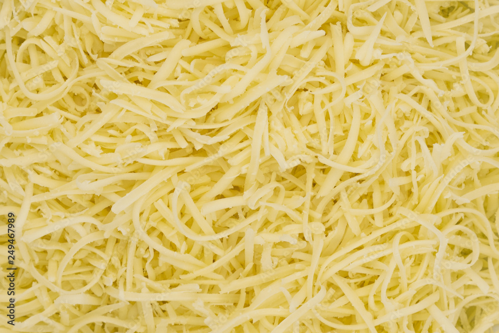 Grated cheese texture background Grated cheese texture background