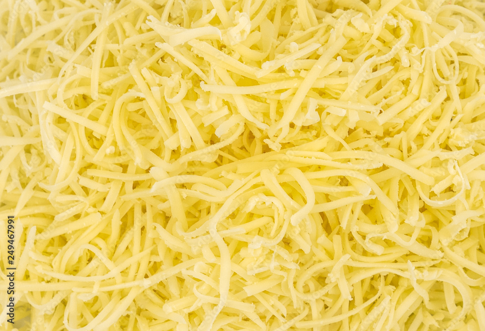 Grated cheese texture background Grated cheese texture background