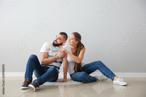 Young couple sitting on flo...