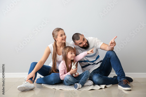 Happy family sitting on flo...