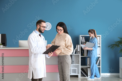 Doctor consulting patient i...