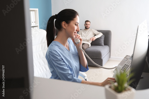 Female receptionist talking...