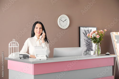 Young female receptionist t...