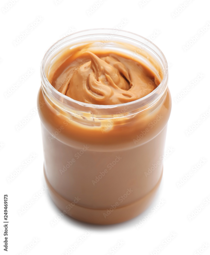 Jar with tasty peanut butter on white background Jar with tasty peanut butter on white background