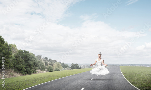 Young woman keeping mind conscious.