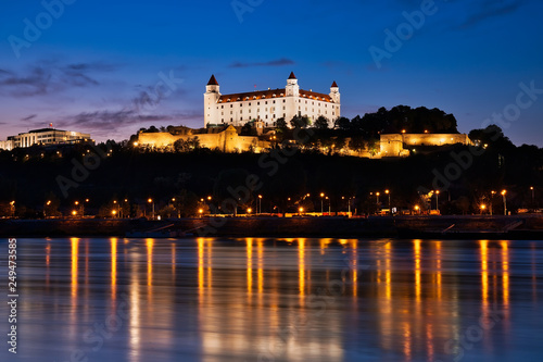 Canvas Print Bratislava castle at night, city lights reflection in Danube river