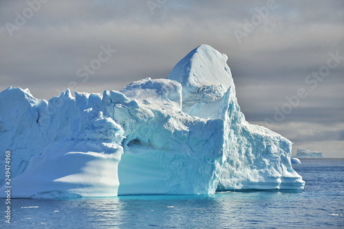Icebergs drift in the ocean.